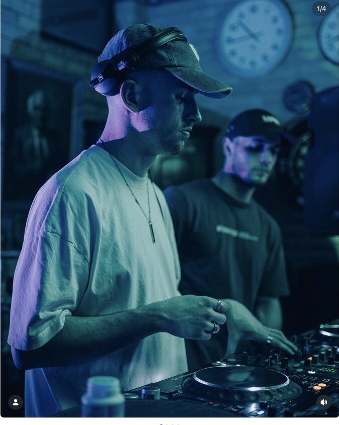A DJ in a white shirt performing at Peggy McCools